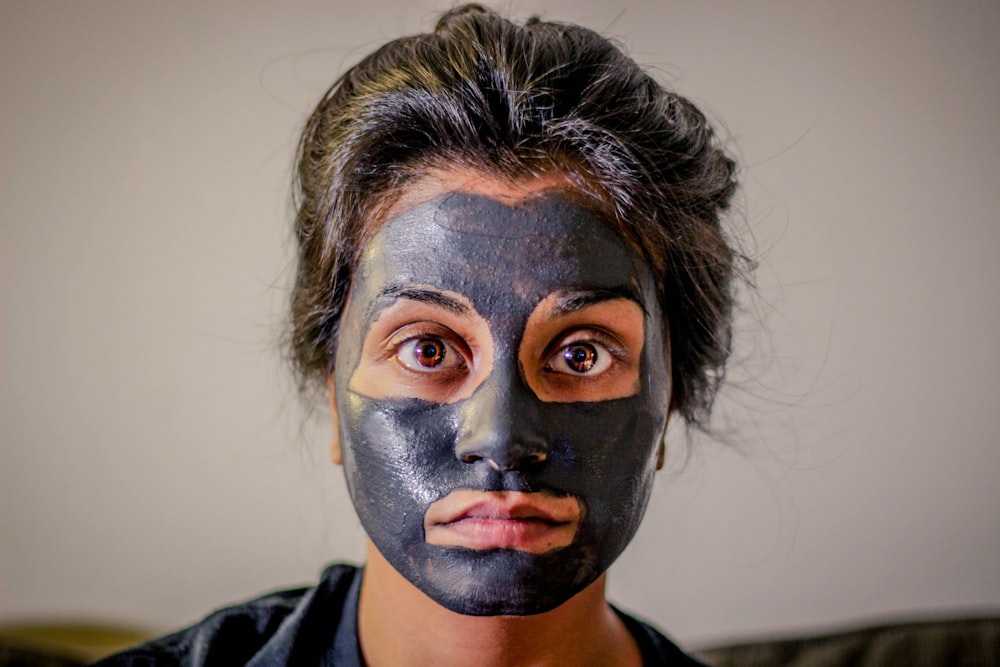 woman with gray facial mask
