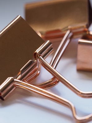 Close-up of high-quality paper clips and binder clips in various sizes.