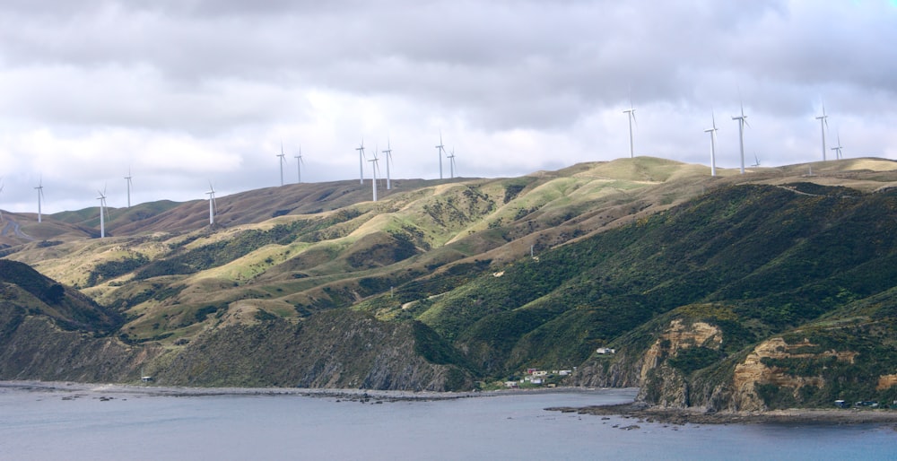 closeup photography of mountain cliff near body of water