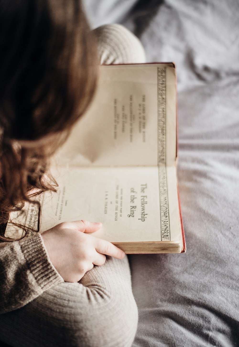 photography of person holding book