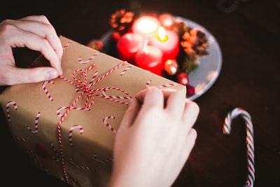 person holding box father christmas teams background