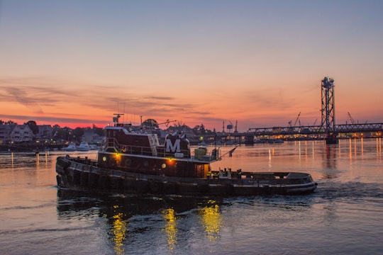 pontoon boat with bridge as background photo in Portsmouth United States