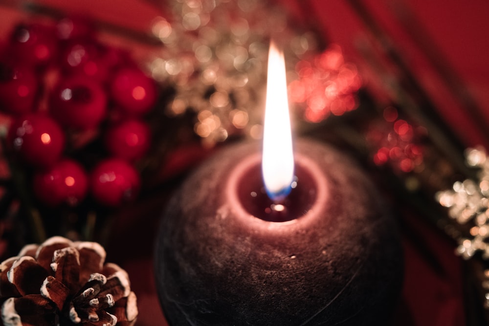 selective focus photography of flamed candle