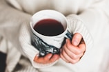 person holding cup of coffee
