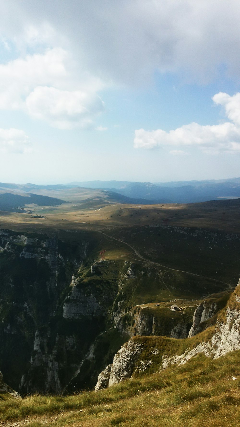 landscape photography of mountain under cloudy sky during daytime