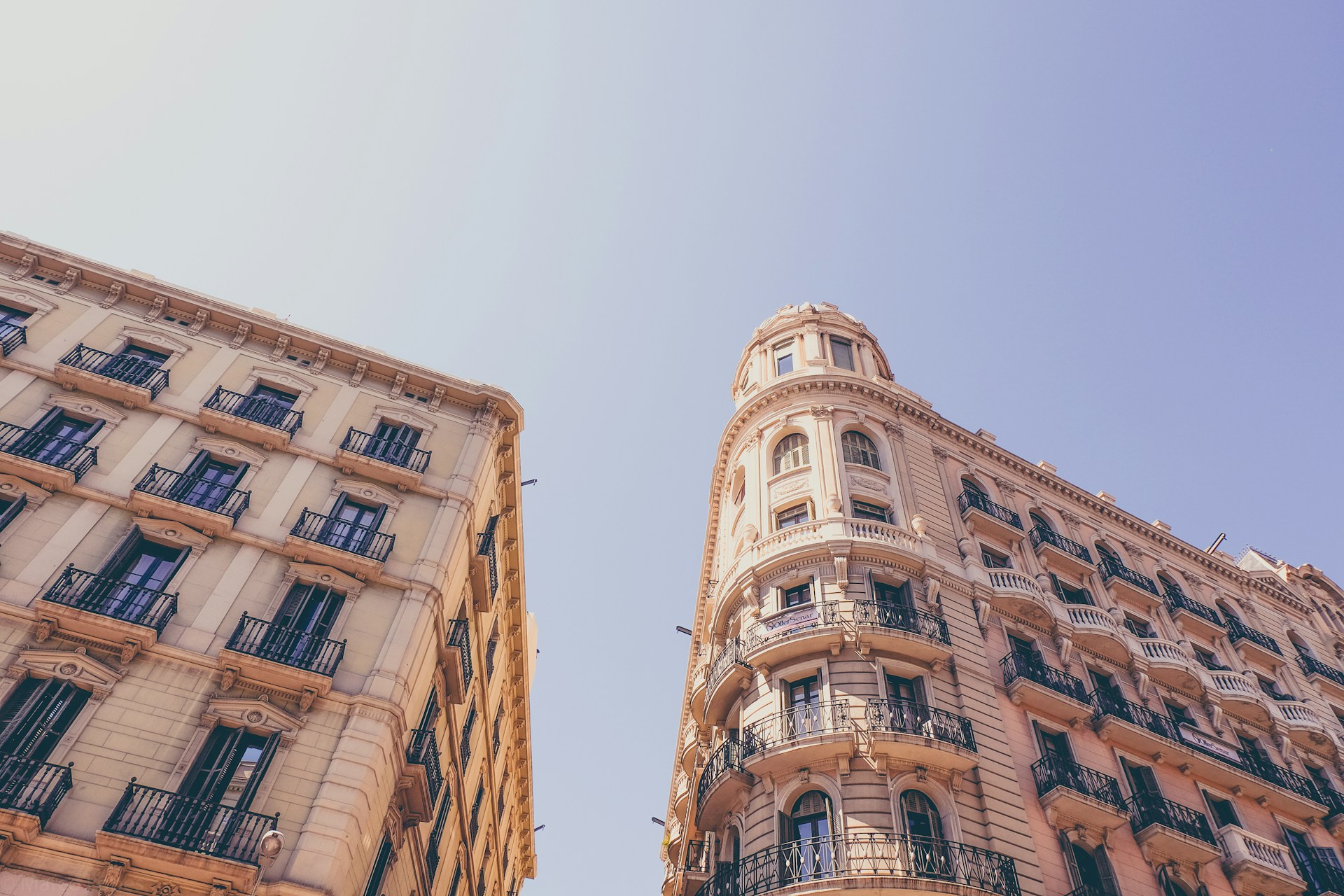 worm's eyeview photo of beige high-rise buildings
