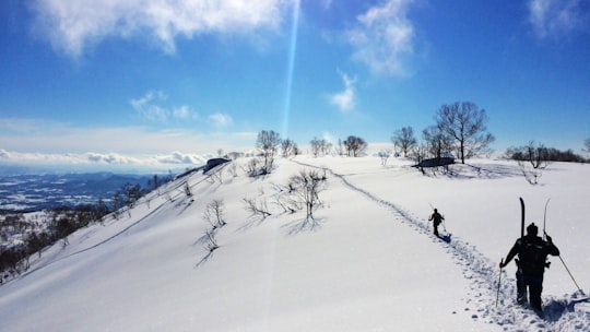 rule of thirds photography of person on white snow in Niseko Japan