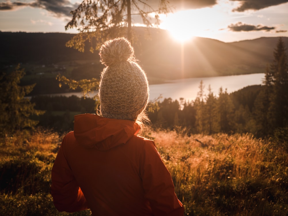 person standing in front of trees