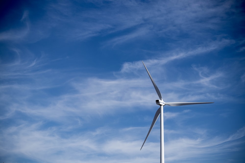 tilt-shift photography of white windmill during daytime