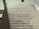 The image features an open book with a page of Portuguese text. The title reads 'Esses poetas,' followed by several poetic lines. The lighting is warm and casts a soft shadow on the page, suggesting early morning or late afternoon sunlight.