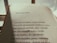 The image features an open book with a page of Portuguese text. The title reads 'Esses poetas,' followed by several poetic lines. The lighting is warm and casts a soft shadow on the page, suggesting early morning or late afternoon sunlight.