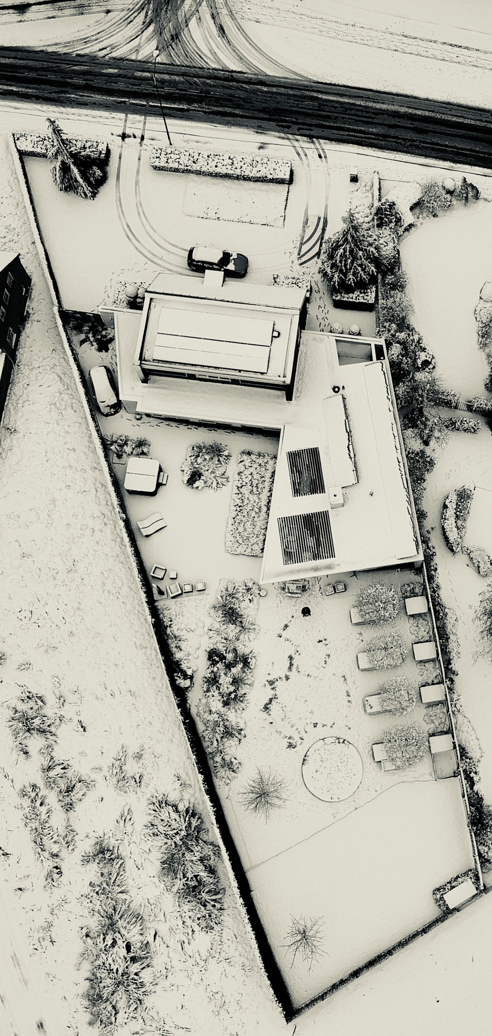 bird's eye photography of concrete building near road