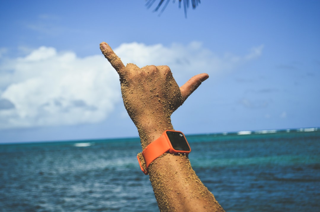 person doing hand sign,