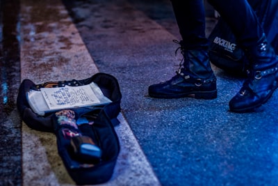 two black bags on pedestrian lane boot teams background