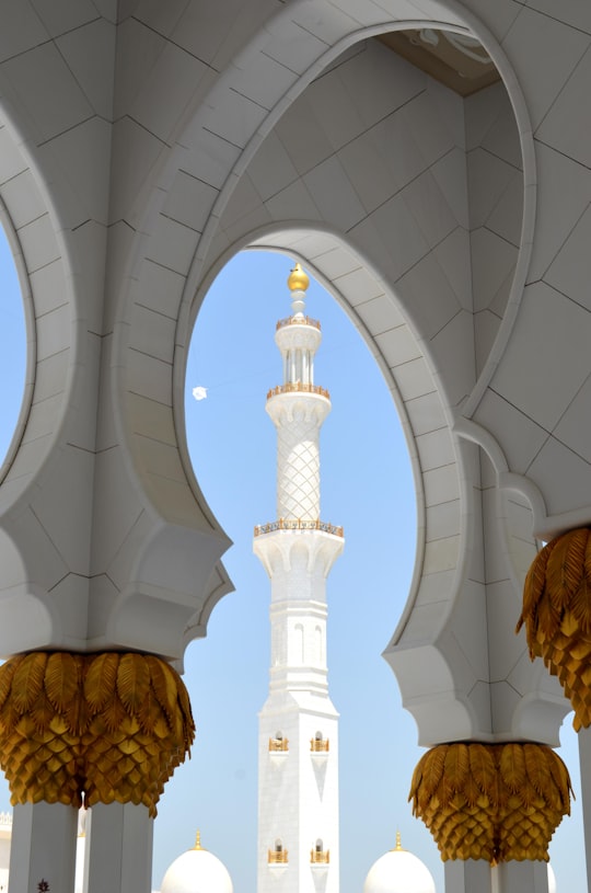 concrete tower under clear blue sky in Sheikh Zayed Grand Mosque Center United Arab Emirates