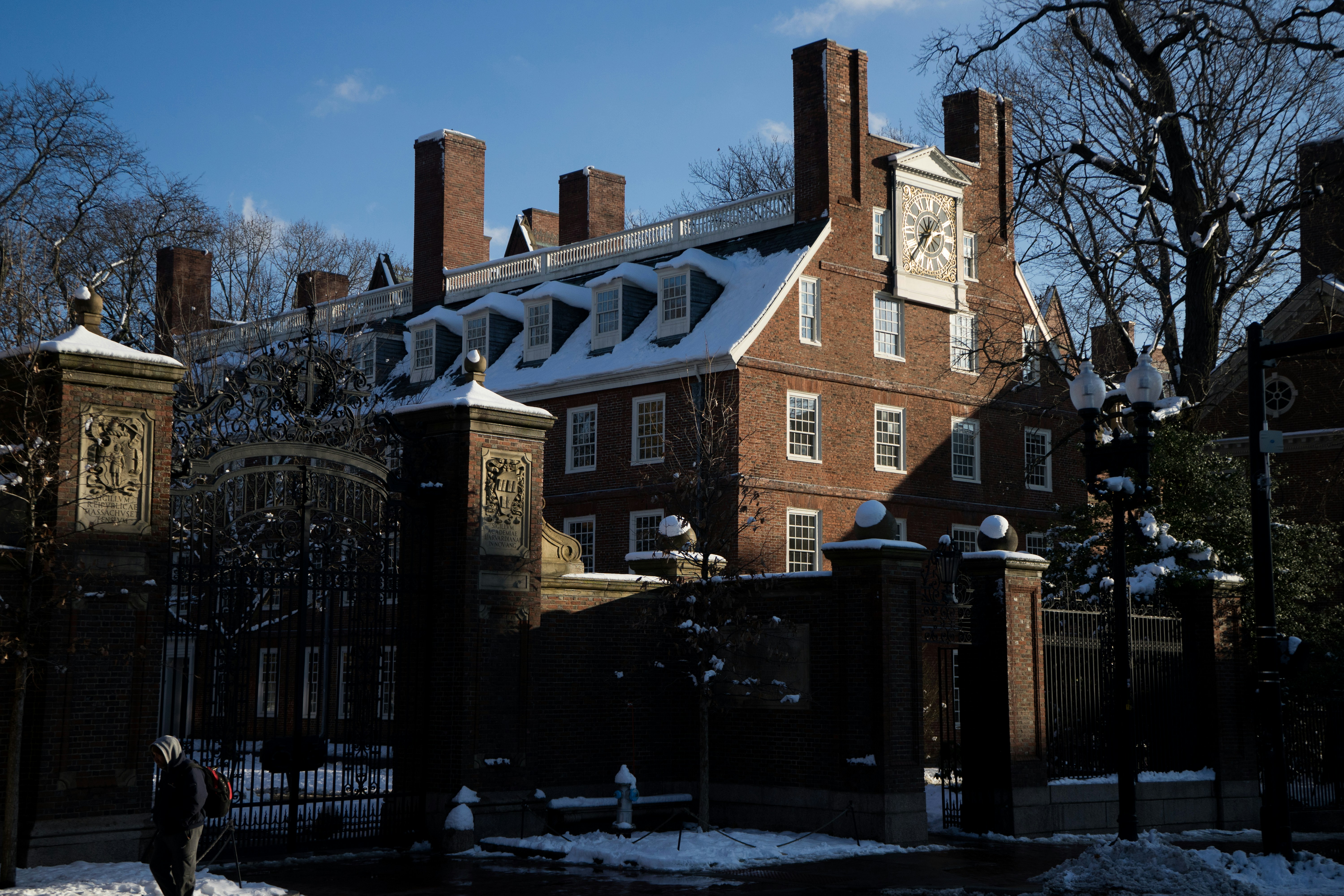 a large brick building with a clock on the top of it
