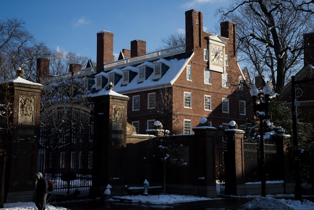 a large brick building with a clock on the top of it