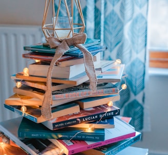 brown wooden framed candle holder on top of books