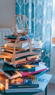 brown wooden framed candle holder on top of books