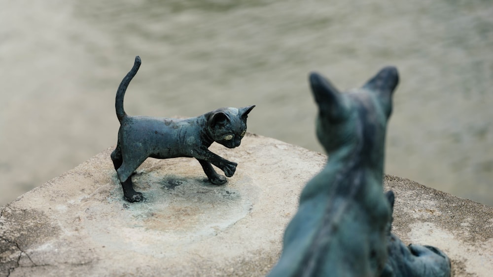 two black cat statues