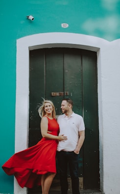 man and woman standing near door during daytime