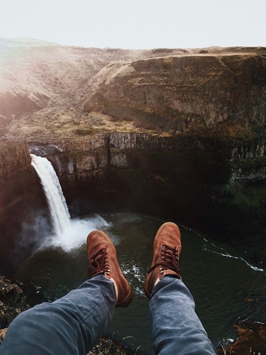 person's pair of brown shoes in Palouse Falls United States