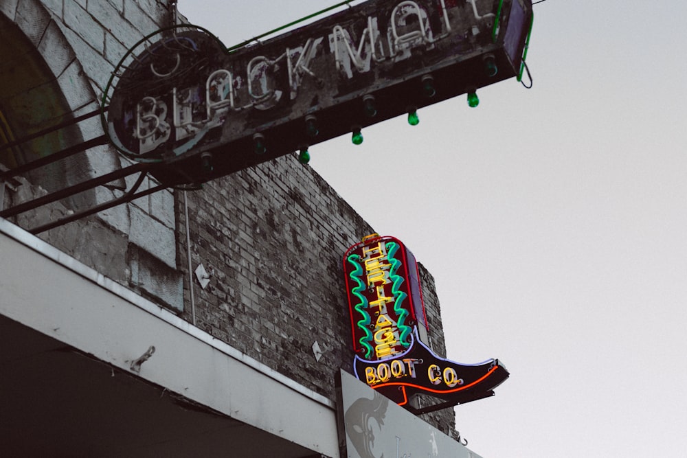 low angle photography of Black Mall signboard