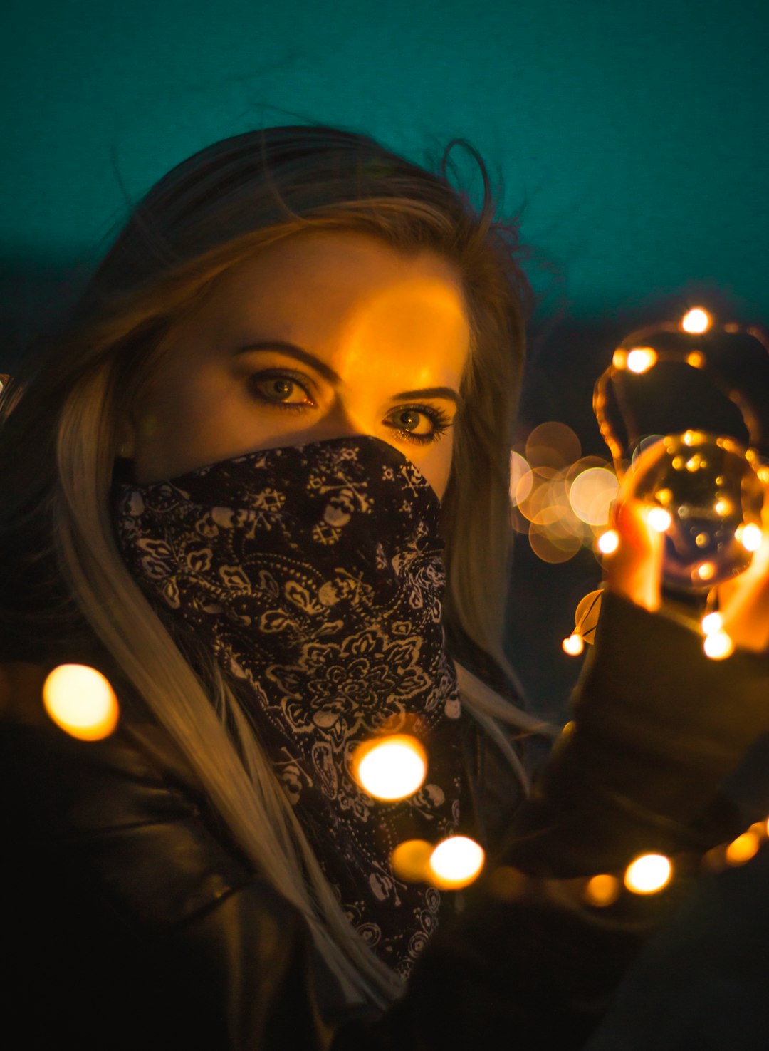 bokeh woman near string light