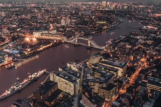 An aerial view of Tower Bridge and the River Thames in London at night