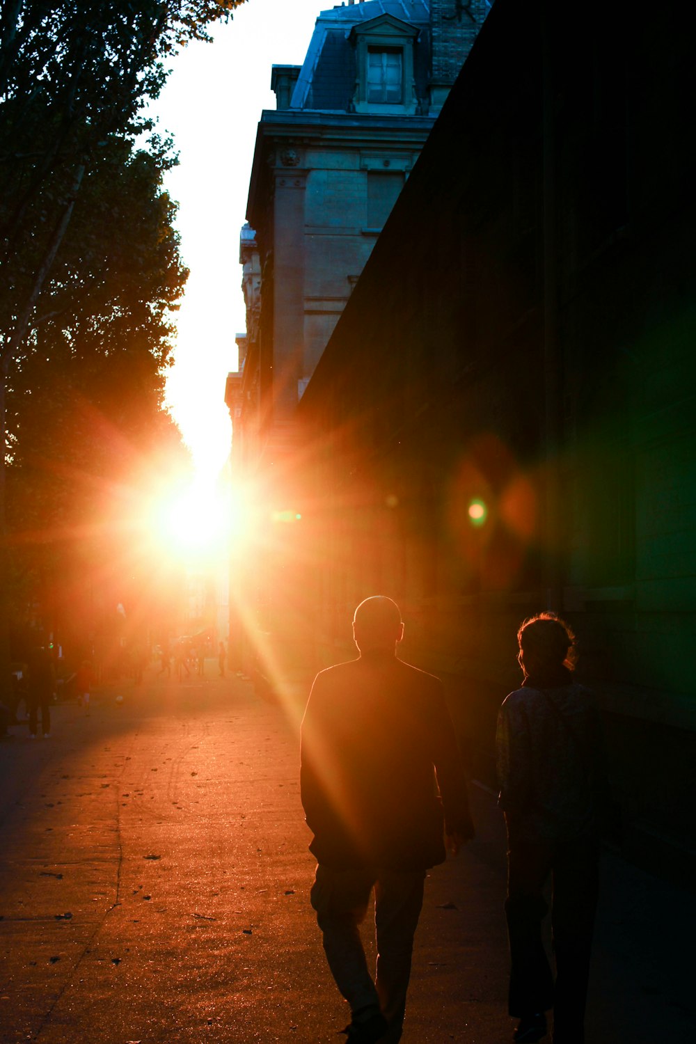 photo of man and woman walking on street