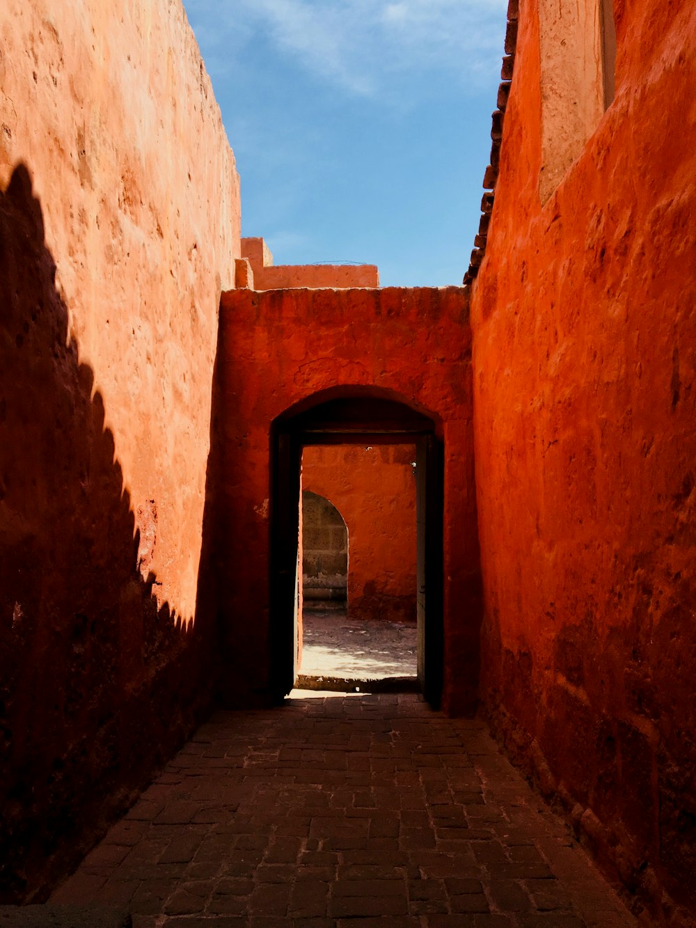 brown brick walls under blue skies