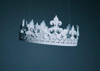 shallow focus photography white crown hanging decor