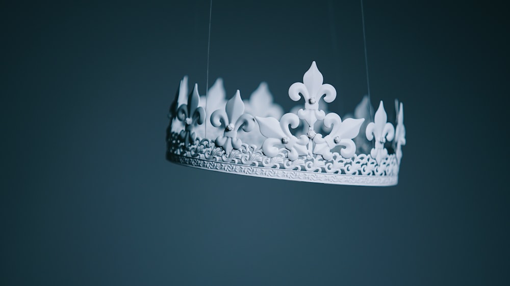 shallow focus photography white crown hanging decor