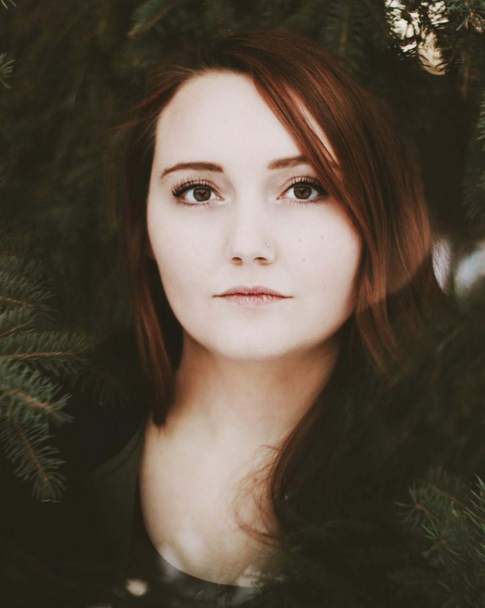 closeup photography of woman near green tree