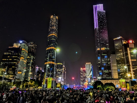 photo of lighted concrete buildings at night in Haixinsha China