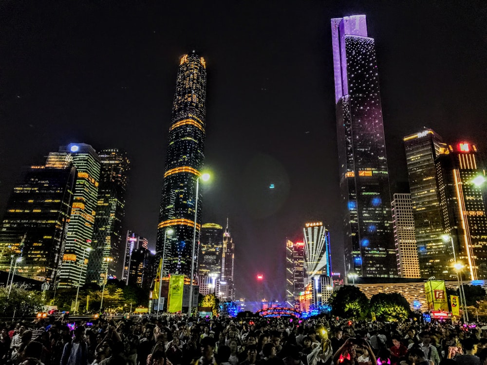 photo of lighted concrete buildings at night