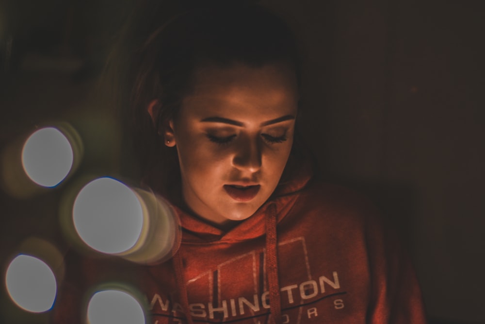 woman wearing red hoodie