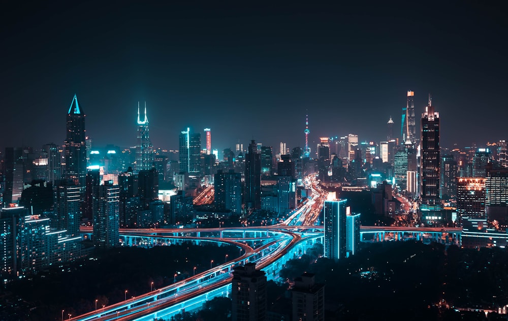 aerial photography of lightened city buildings at night time