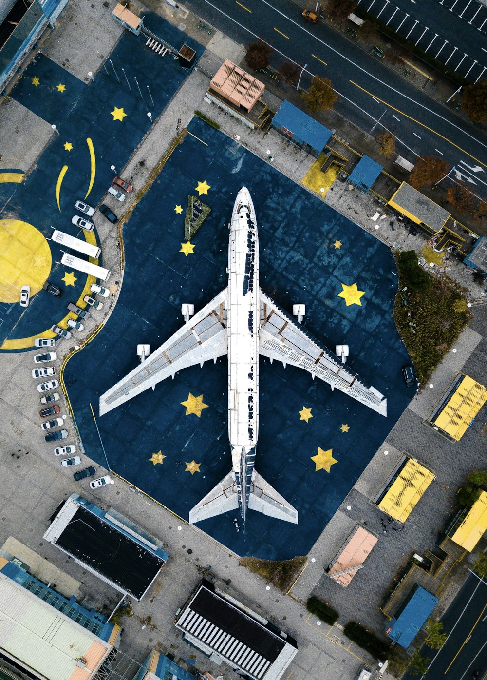 aerial photography of white and black air liner on airport during daytime