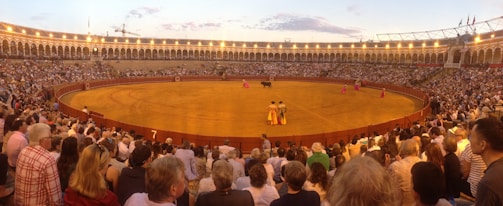 The midget bullfighters celebrating a successful show with the crowd.