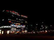 Brightly lit commercial building exterior showcasing professional lighting installation.