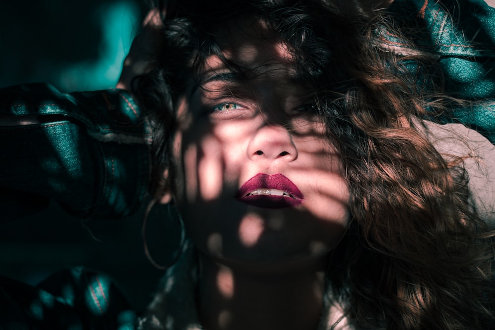 woman in between forest leaves