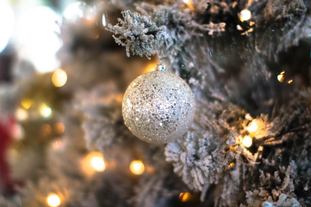 round gray bauble hanging on Christmas tree