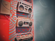 three gray boombox hanging on wall