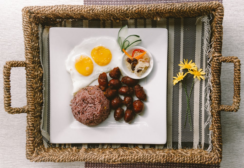 plate of foods on brown wicker tray