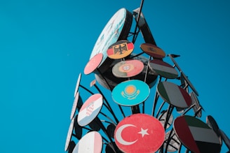 Flags from various countries arranged in a circle to represent worldwide cooperation.