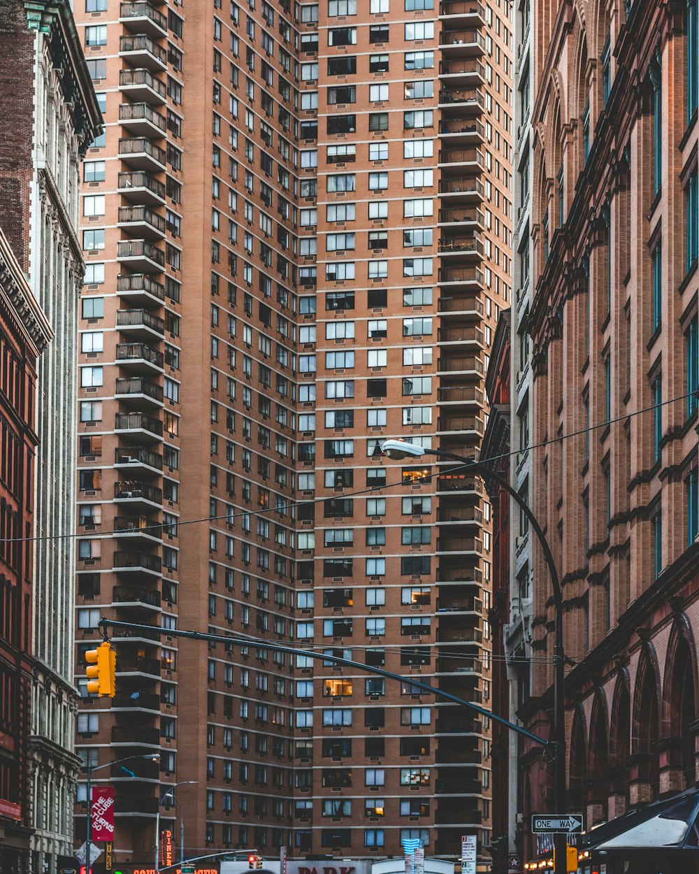 brown high rise building low angle photography