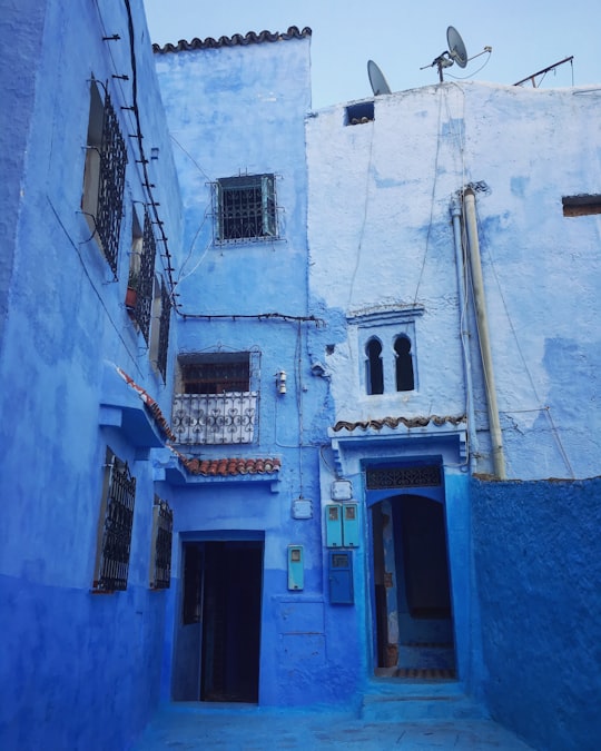 blue and gray concrete 3-storey building in Chefchaouen Morocco