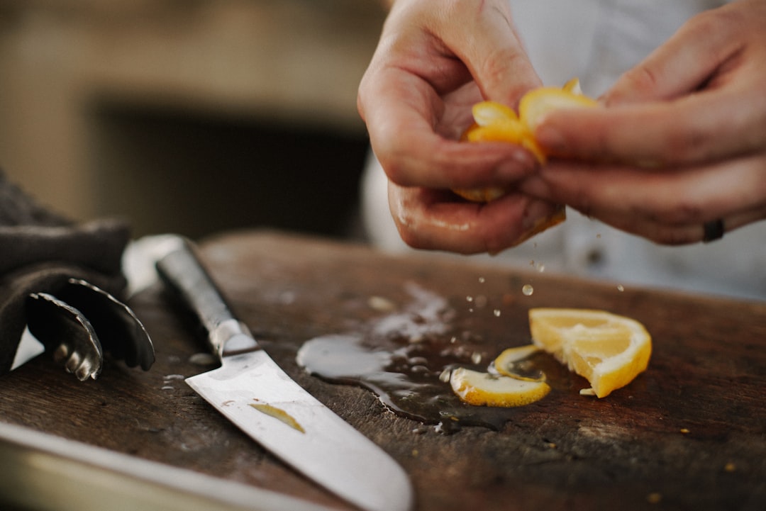 person holding citrus fruit