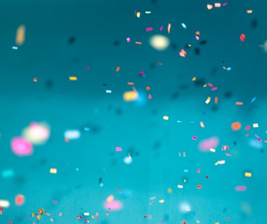 selective focus photography of multicolored confetti lot